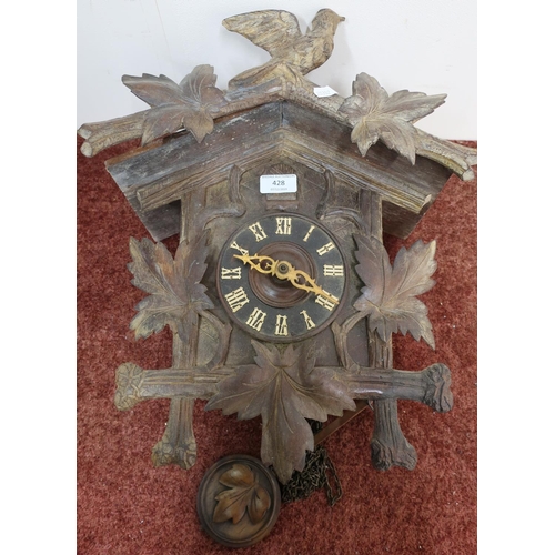 428 - Early 20th C Black Forest wall clock with striking movement, carved decoration