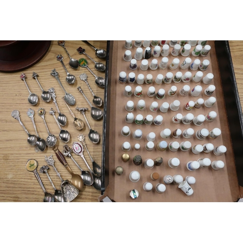44 - Souvenir bone china thimbles and a small collection of souvenir spoons