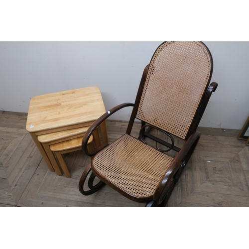 88 - Beech Bentwood rocker with bergere seat and back, and a nest of three light beech occasional tables