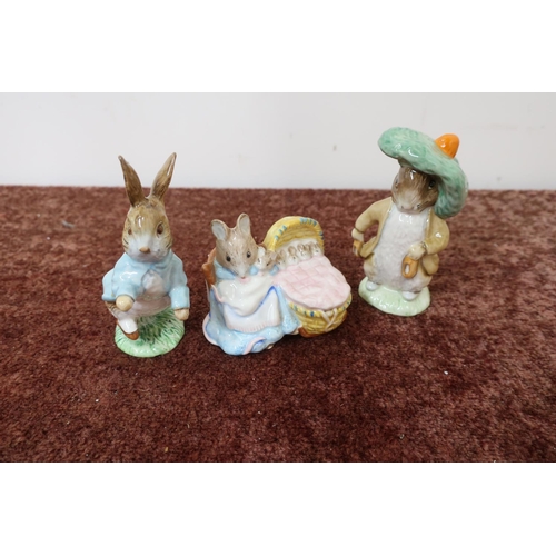 9 - Royal Albert Beatrix Potter Hunca Munca figure, a Royal Albert Benjamin Bunny and a Beswick Peter Ra... 