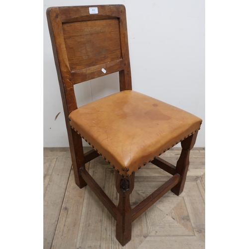 453 - Golden oak Whittaker of Littlebeck 'Gnomeman' hall chair, panel back and leather seat