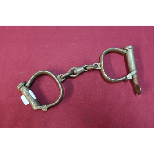 12 - Pair of steel handcuffs