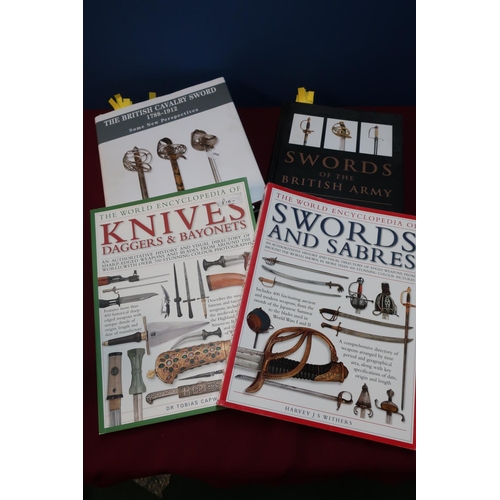 123 - Four reference books including Encyclopedia of Knives, Daggers and Bayonets, Encyclopedia of Swords ... 