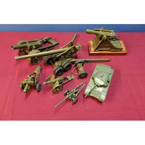 135 - Box of various Dinky Britons and other military field guns and Centurion tank including one mounted ... 