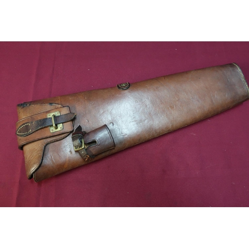 21 - Tan leather Cavalry holster with brass locking strap and sword mount attachment