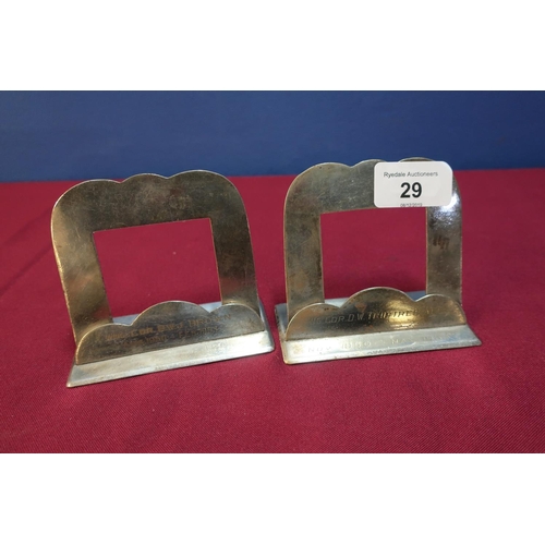 29 - Two silver plated place name holders, possible from the RAF Club by Harrison Brothers, No. 3479 with... 