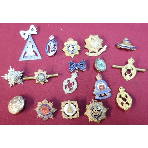 73 - Fifteen assorted sweetheart brooches and military lapel badges for various regiments including silve... 