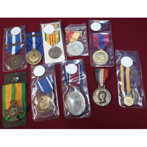 77 - Group of ten various foreign and national medals including Nato, Kosovo and Non Article 5, French me... 