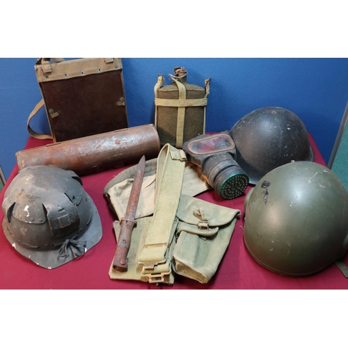 84 - Box of various militaria including steel helmet, gas mask, steel containers, map casings, water bott... 