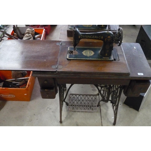 56 - Uniquely painted Singer sewing machine in original table