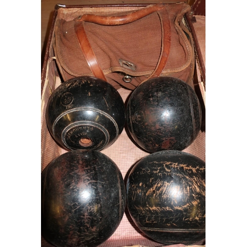 28 - Small vintage case with six wooden bowling green balls