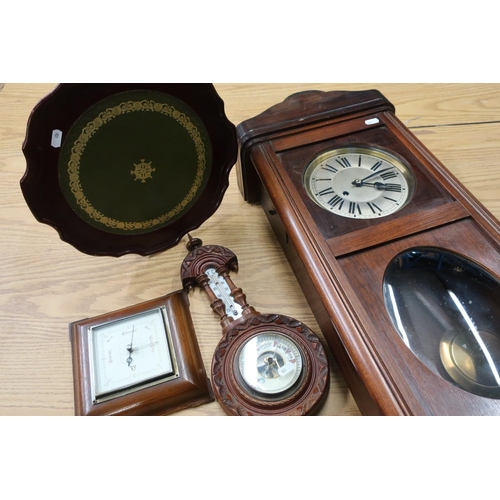 76 - Mahogany cased wall clock, an oak cased wall barometer, another barometer and a small occasional tab... 