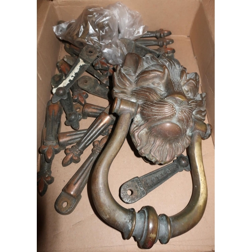 84 - Heavy bronze lion mask doorknocker and a selection of brass carpet runner fixings No. 22250