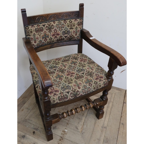 218 - Oak framed armchair with upholstered seat and back on turned supports