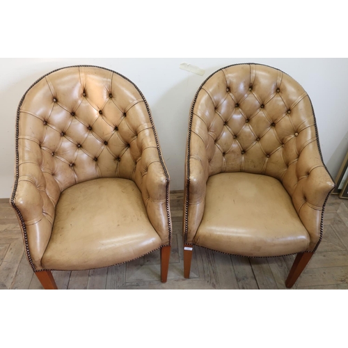 228 - Pair of early - mid 20th C tan leather deep button back armchairs on tapering supports