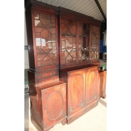 256 - 19th C mahogany breakfront bookcase by Gillows with upper central section enclosed by two glazed doo... 