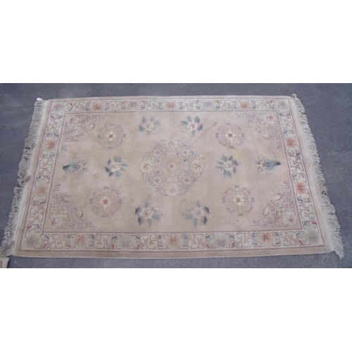 284 - Chinese embossed washed wool rug, beige ground with central floral medallion surrounded by floral pa... 