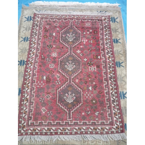 286 - Persian type heavy woven hand knotted red ground rug (152cm x 107cm)