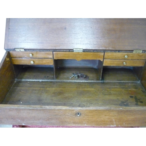 215 - 19th C oak table top desk with sloped lift up front revealing fitted interior (108cm x 65cm x 30cm)