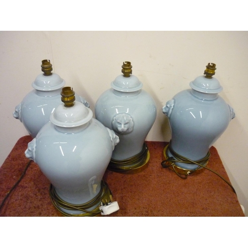 198 - Set of four ceramic table lamps with lion mask handles