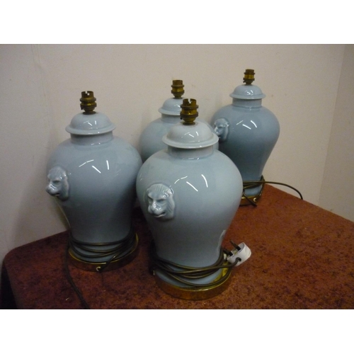 199 - Set of four ceramic table lamps with lion mask handles