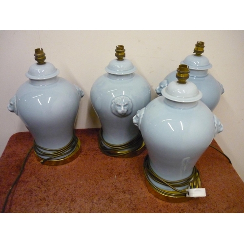 201 - Set of four ceramic table lamps with lion mask handles