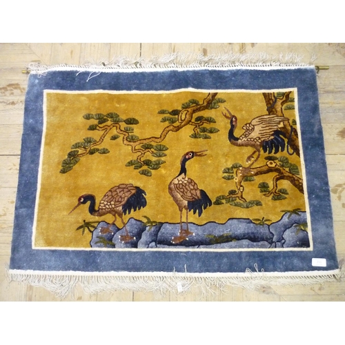 211 - Chinese wool-work style carpet wall hanging with brass hanging rail decorated with blue border and c... 