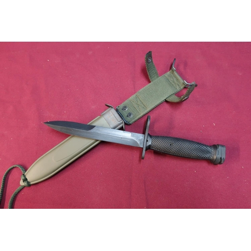 64 - American US.M8A1 bayonet with blackened blade complete with sheath and frog