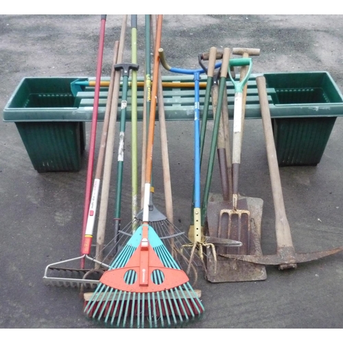 2 - Large collection of garden tools, including pick-axe, rakes, forks, hose, and a plastic bench