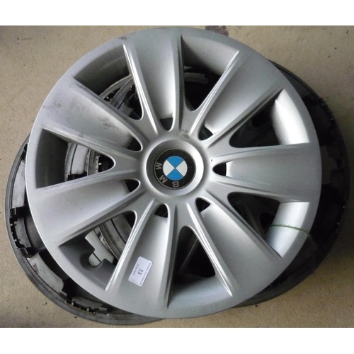 33 - Set of four plastic BMW wheel covers