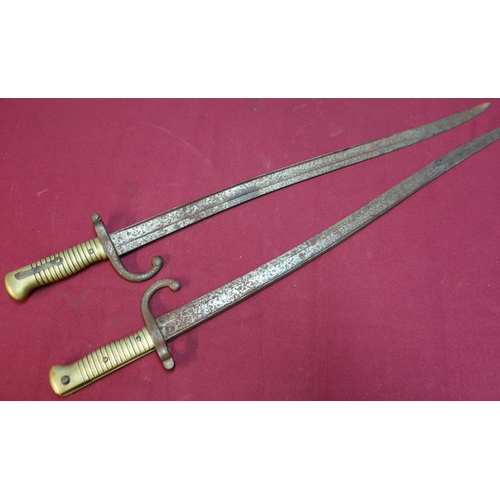 48 - Two French 19th C bayonets with brass grips