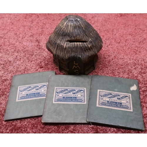 1 - Unusual carved wood and papier-mache money box in the form of a hay stack marked LMS, and three pock... 