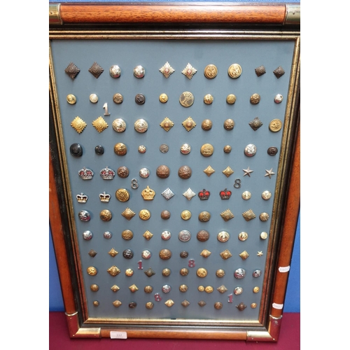 112 - Framed and mounted display of military buttons, pips and insignia for various British and overseas r... 