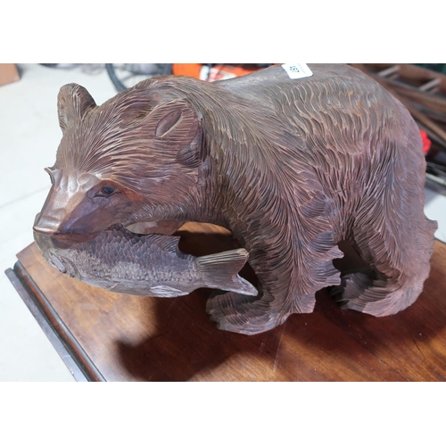 487 - Large carved wood Black Forest style bear and salmon (height 22cm)