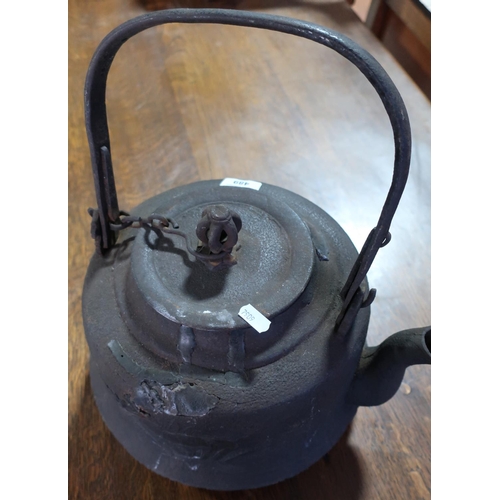 489 - Large Japanese heavy cast metal teapot with swing handle (height 25cm)