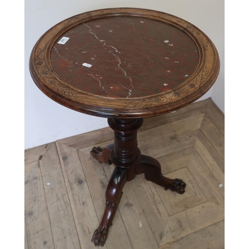 502 - Unusual Victorian circular top table on turned revolving column of three out-splayed lion paw feet, ... 