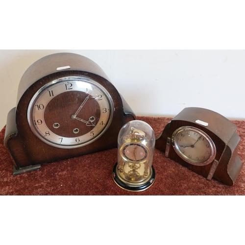 100 - Early 20th C oak cased mantel clock, another similar 1920s clock and a domed clock (3)
