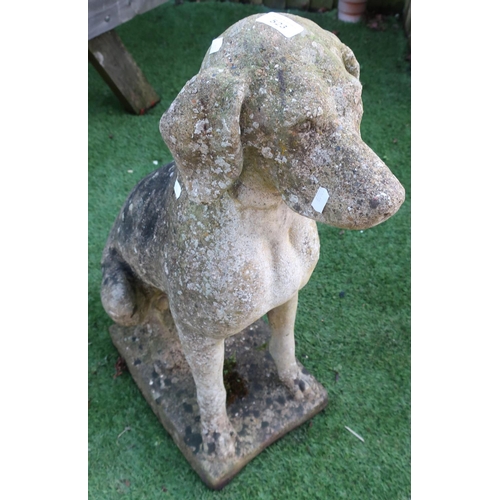 523 - Composite stone figure of a seated dog (height 75cm)