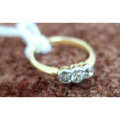 558 - 18ct gold and three stone diamond ring (size M)