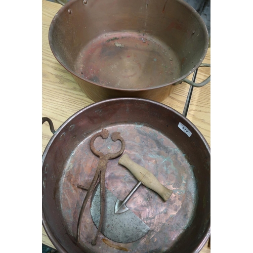 577 - Two large twin handled copper pans, pair of sugar nips and a pastry cutter (4)