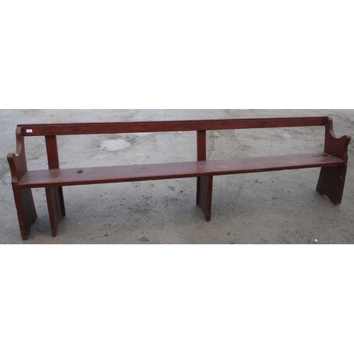 509 - Stained pine rustic pew type bench (width 266cm)