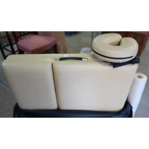 548 - Folding treatment/massage table in carry bag