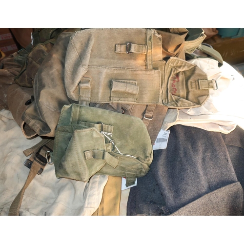 162 - Three various military canvas kit bags and various part RAF uniform (moth eaten), military haversack... 