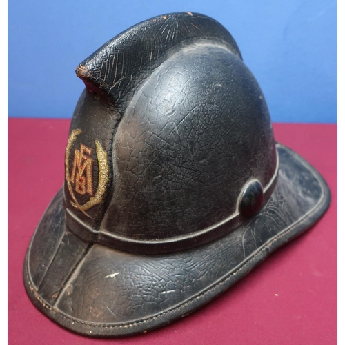 148 - Leather covered fireman's helmet, the front marked FMB within laurel, the inside complete with leath... 
