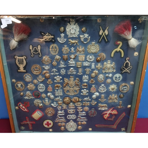 154 - Framed and mounted display case of Victorian and later military cap badges and insignia including fu... 
