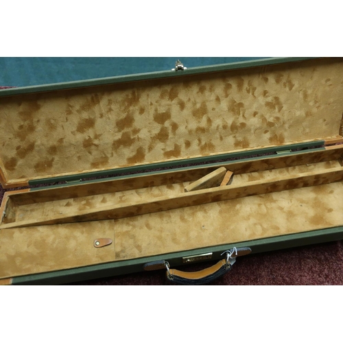 454 - Canvas and leather trimmed gun case with combination lock, to fit 31 inch barrels