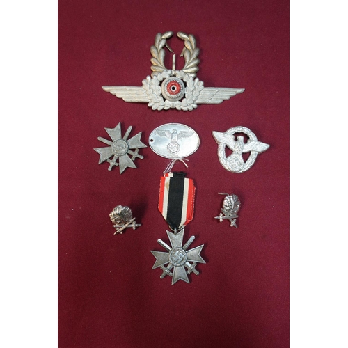 231 - Selection of various German military badges including Merit Crosses, lapel badges, etc