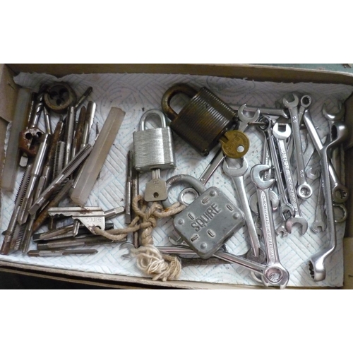 11 - Small box containing a quantity of small spanners, locks, and dies