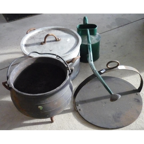 44 - Large cooking pot, watering can, a cast iron cauldron and a bakestone