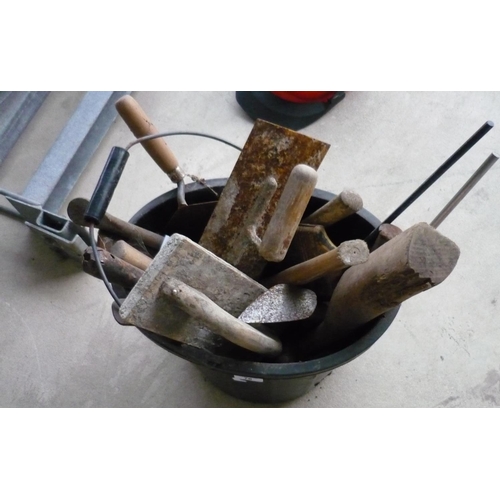 76 - Bucket containing a quantity of tools, including hammers, trowels etc